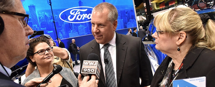 Joe-Hinrichs-president-global-operations-speaking-to-media