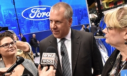 Joe-Hinrichs-president-global-operations-speaking-to-media