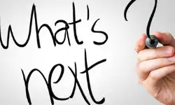 _whats-next-hand-writing-with-a-marker-on-transparent-board